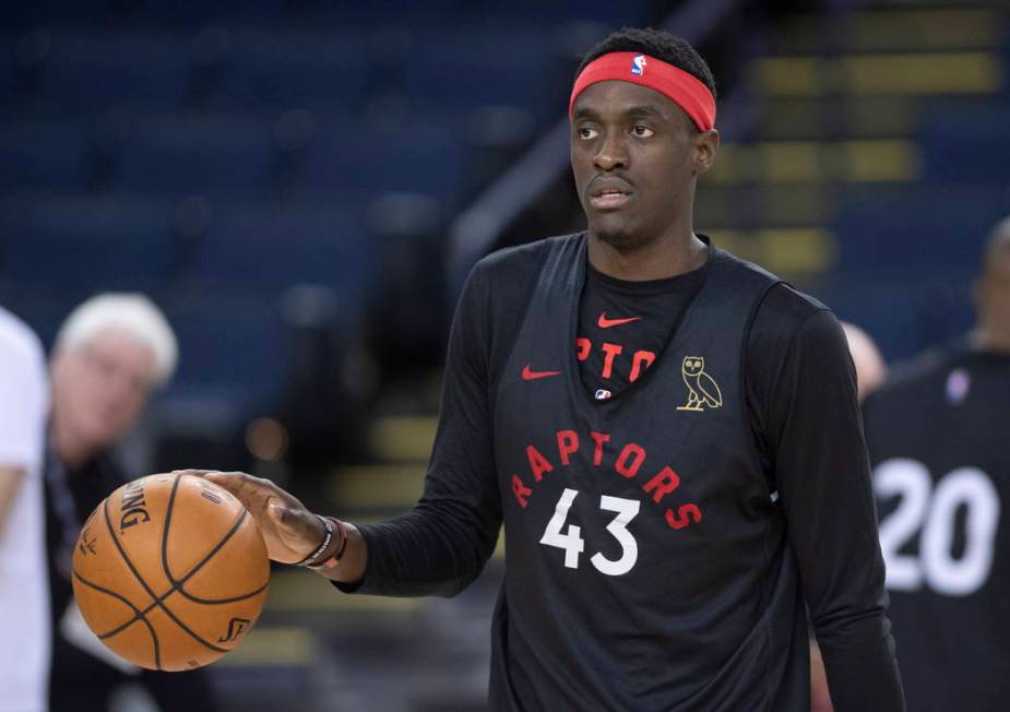 Toronto Raptors' Pascal Siakam dribbles the ball during a team practice in Oakland, Calif., Wed ...