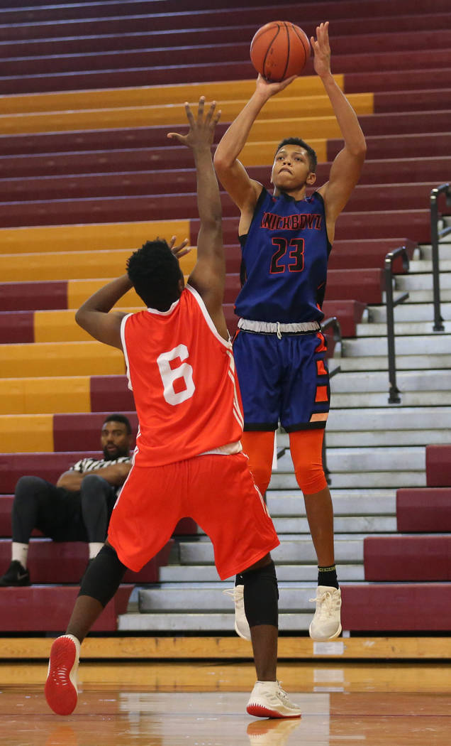 Las Vegas Knicks guard Nick Blake (23) takes a shot during his basketball game at Del Sol Acade ...