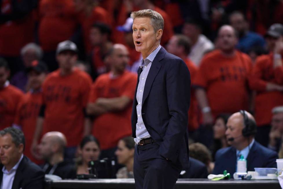 Golden State Warriors coach Steve Kerr watches the action against the Toronto Raptors during se ...