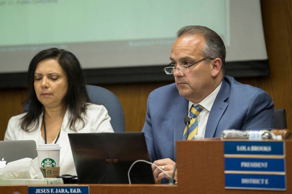 Clark County School Superintendent Dr. Jesus Jara, right, listens to public comments during a m ...