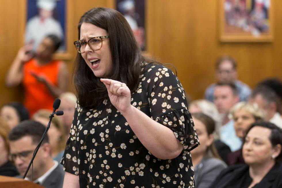 Alexis Salt, a parent and teacher at Leavitt Middle School, gets emotional while addressing the ...