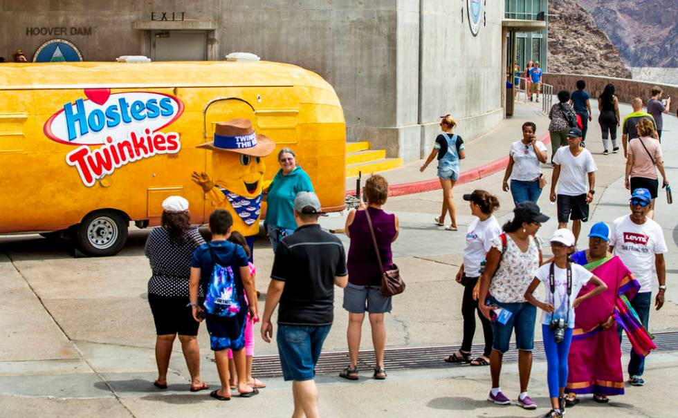 Twinkie the Kid poses with visitors while on a stop at the Hoover Dam in celebration of the 100 ...