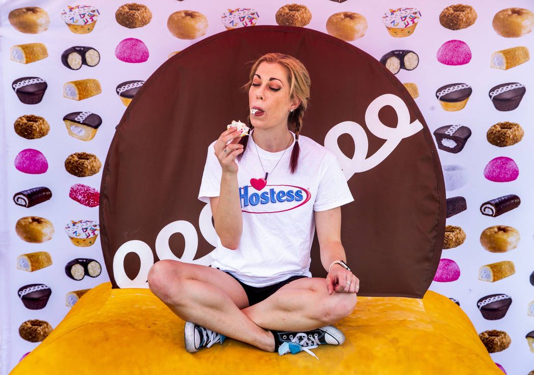 Hostess promoter Casey Weems samples a Hostess Birthday Cupcake while on a stop at the Hoover D ...