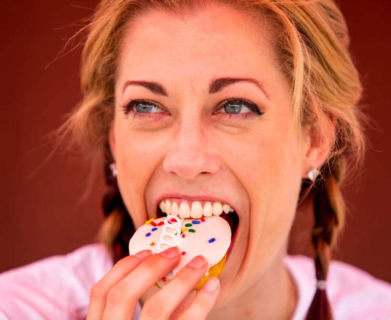 Hostess promoter Casey Weems samples a Hostess Birthday Cupcake while on a stop at the Hoover D ...