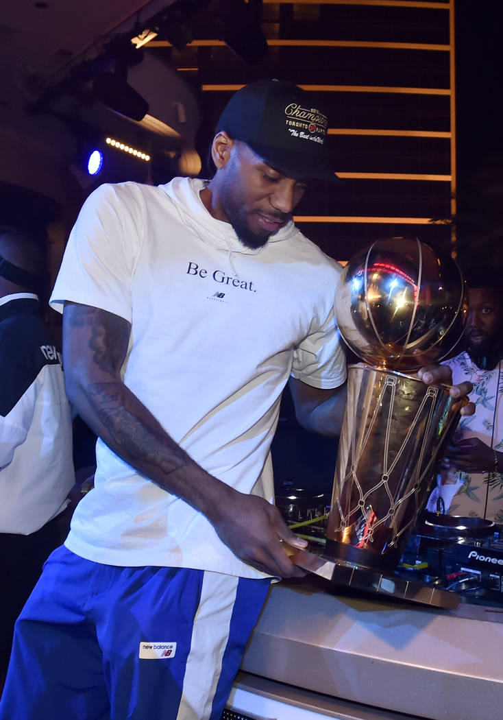 LAS VEGAS, NEVADA - JUNE 14: Kawhi Leonard of the Toronto Raptors celebrates the team's NBA cha ...