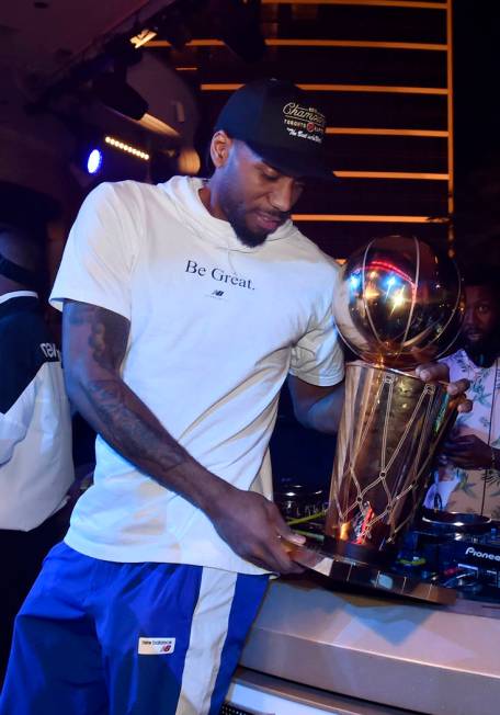 LAS VEGAS, NEVADA - JUNE 14: Kawhi Leonard of the Toronto Raptors celebrates the team's NBA cha ...