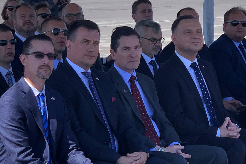 President of Poland Andrzej Duda and others await the landing of a drone at the Reno-Stead Airp ...