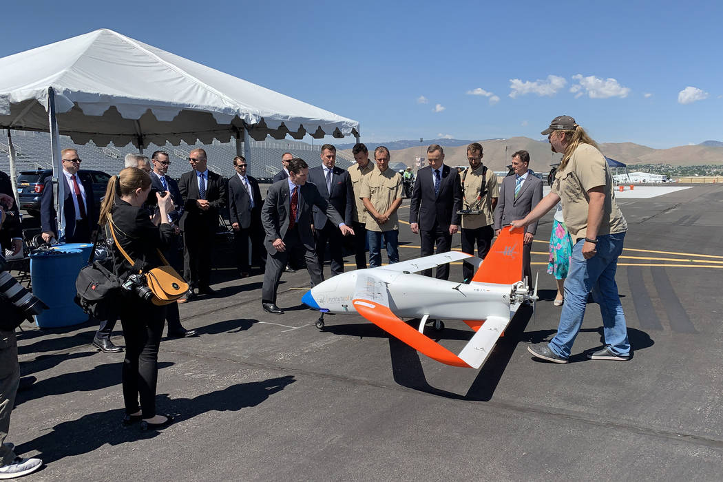 President of Poland Andrzej Duda with the drone demonstration team and their vehicle at the Ren ...