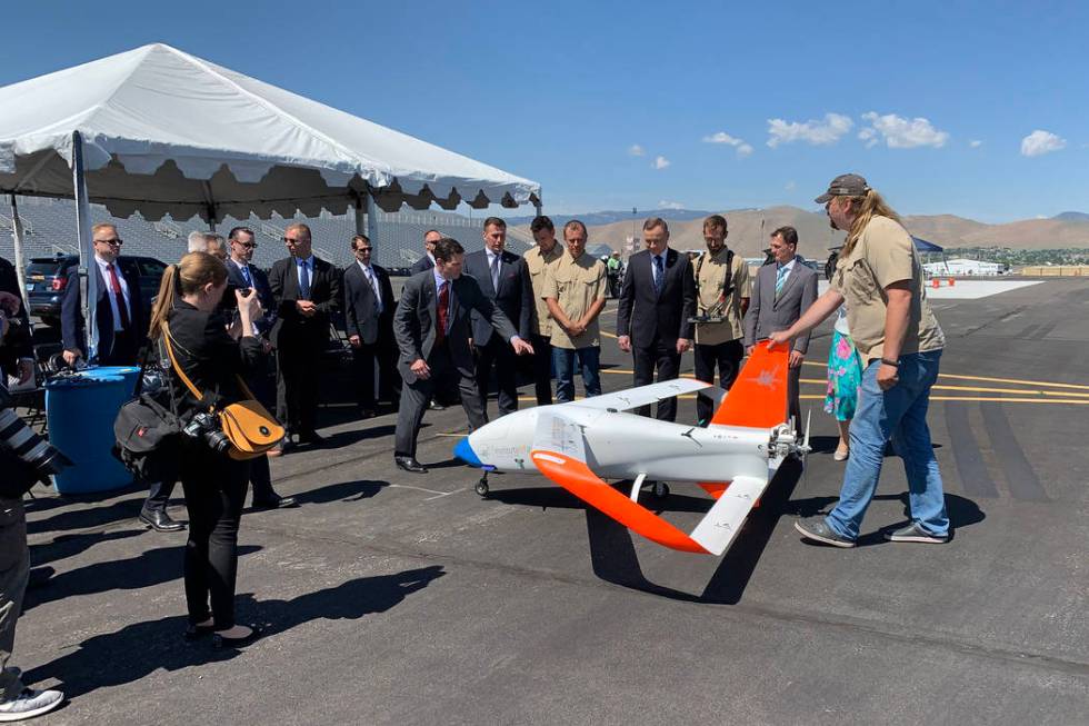 President of Poland Andrzej Duda with the drone demonstration team and their vehicle at the Ren ...