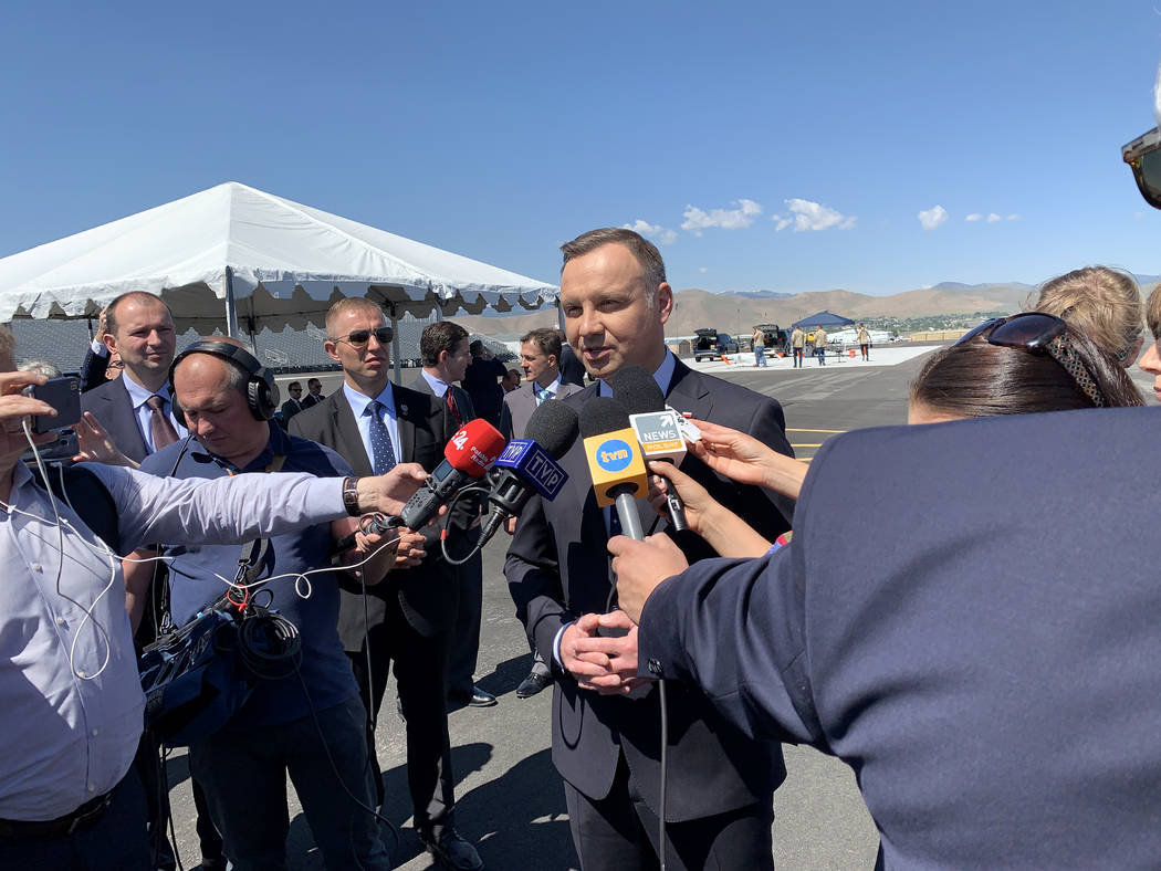 President of Poland Andrzej Duda, at the Reno-Stead Airport Saturday, speaks to Polish reporter ...