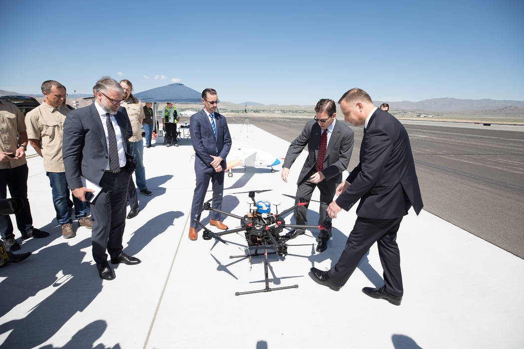 President of Poland Andrzej Duda, right, and Chris Walach, executive director the Nevada Instit ...