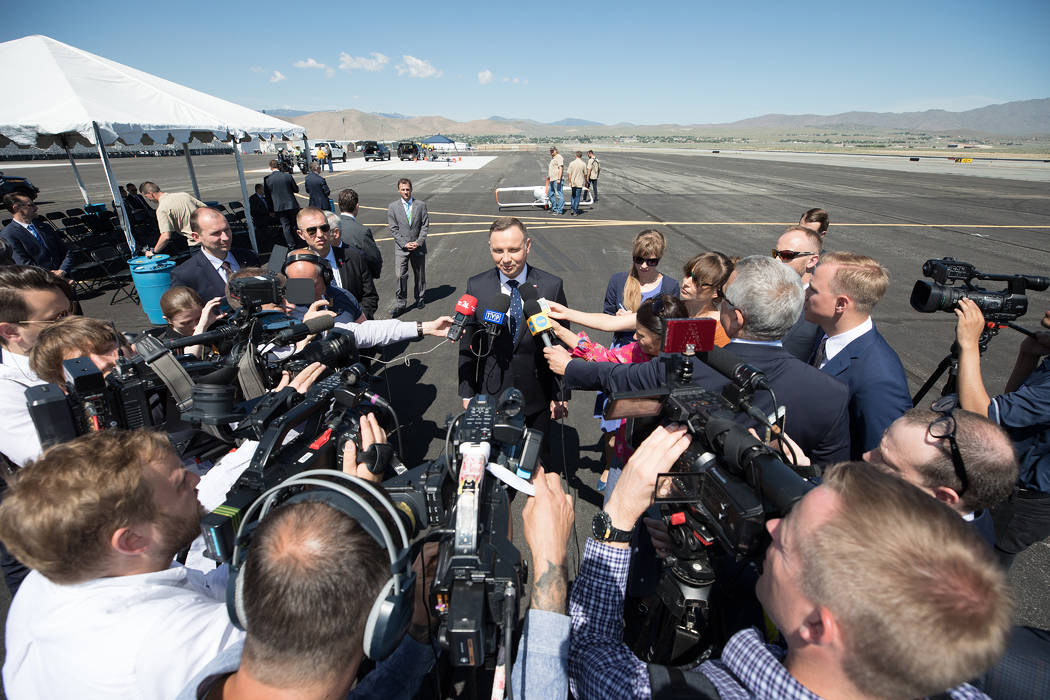 President Duda, at the Reno-Stead Airport Saturday, speaks to Polish reporters traveling with h ...