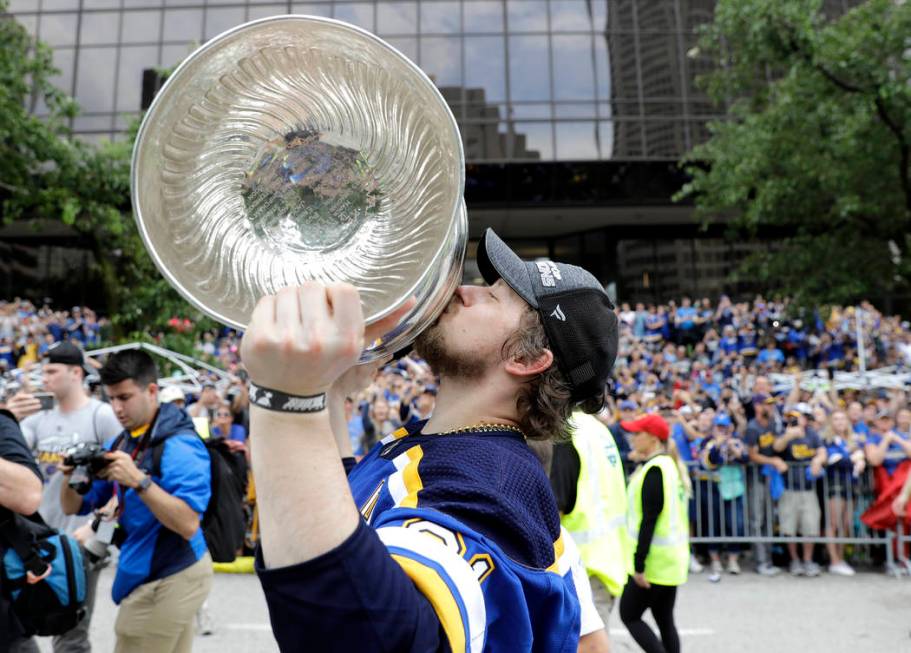 St. Louis Blues right wing Vladimir Tarasenko, of Russia, kisses the Stanley Cup during the Blu ...