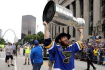 St. Louis Blues center Ryan O'Reilly carries the Stanley Cup during the Blues' NHL hockey Stanl ...