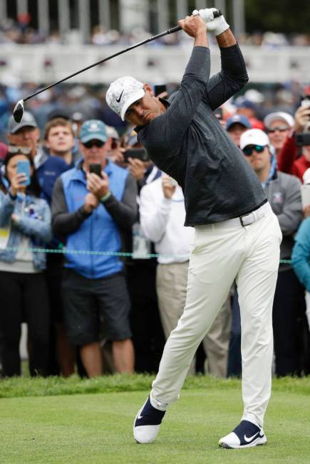 Brooks Koepka hits his tee shot on the third hole during the third round of the U.S. Open Champ ...