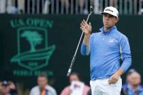 Gary Woodland reacts after missing a putt on the 18th hole during the third round of the U.S. O ...