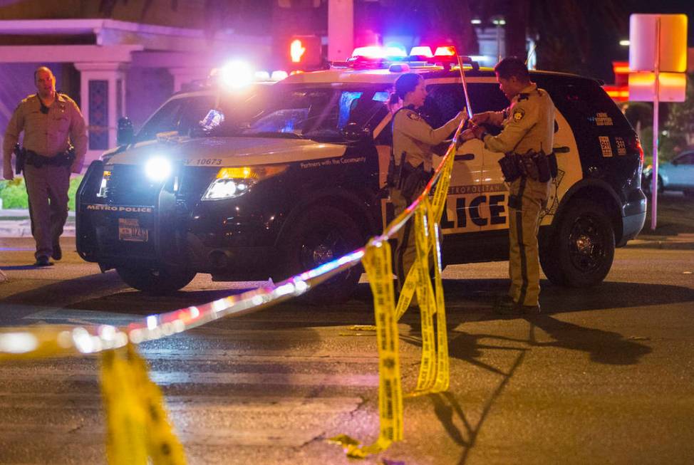 Las Vegas police investigate an officer-involved shooting in the area of West Sahara Avenue and ...