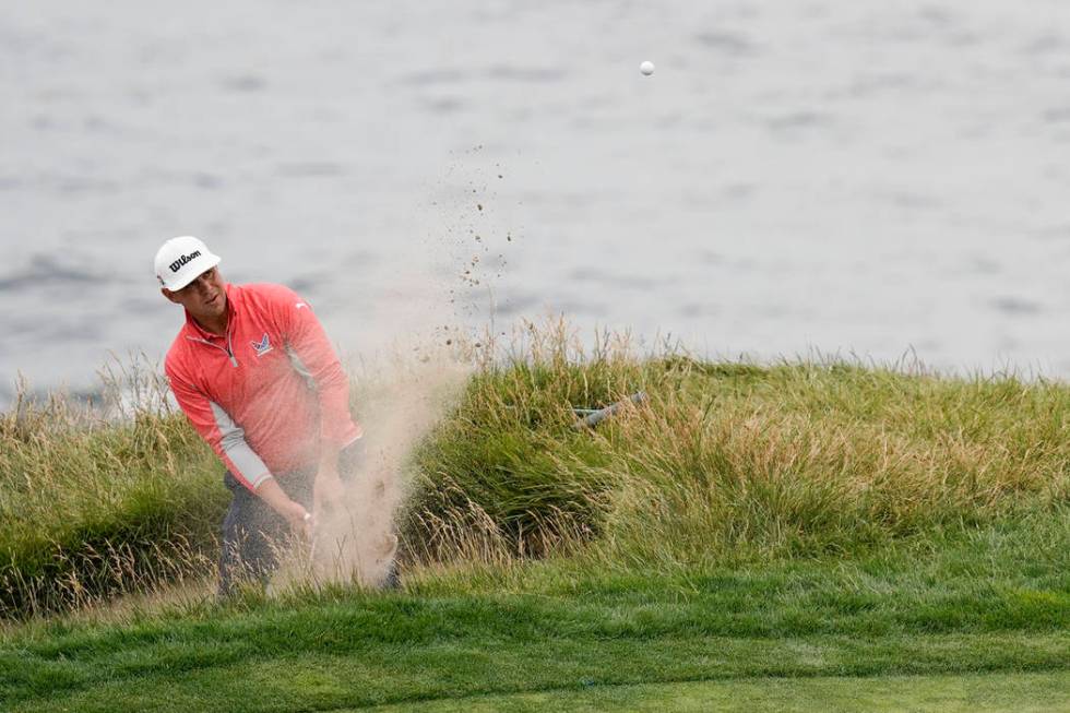 Gary Woodland hits out of the bunker on the seventh hole during the final round of the U.S. Ope ...