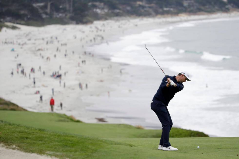 Justin Rose, of England, hits from the fairway on the ninth hole during the final round of the ...