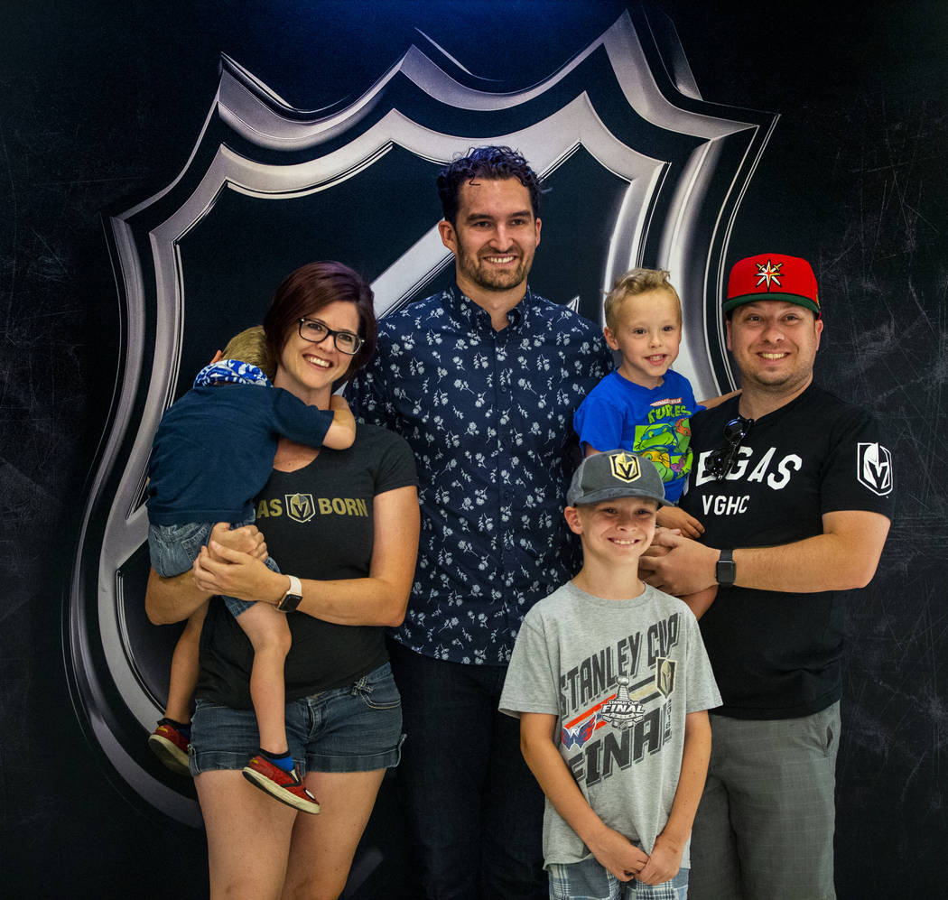 Golden Knights player Mark Stone stands with the Perez family of Las Vegas during a fan photo o ...