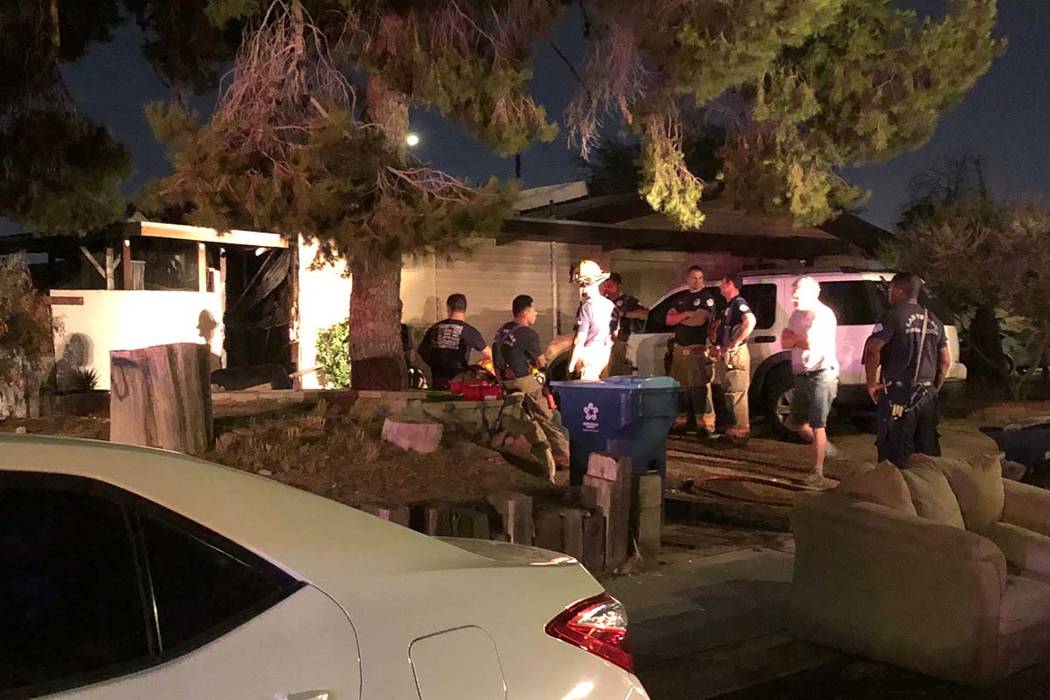 Two people were treated at the scene for smoke inhalation in a fire at two two east Las Vegas V ...