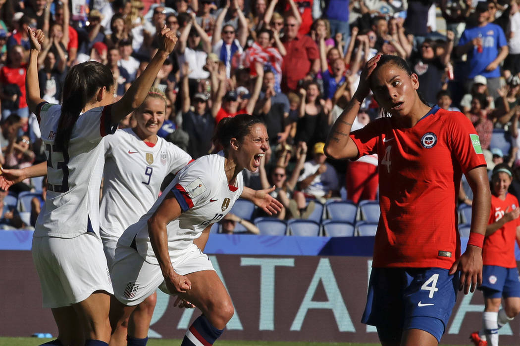 United States' Carli Lloyd, center, celebrates with teammates after scoring their side's third ...