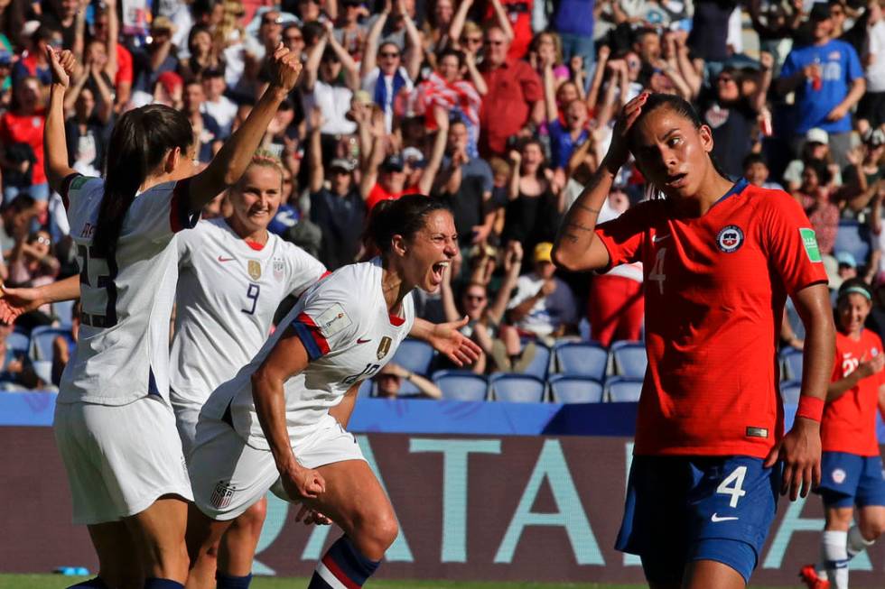 United States' Carli Lloyd, center, celebrates with teammates after scoring their side's third ...
