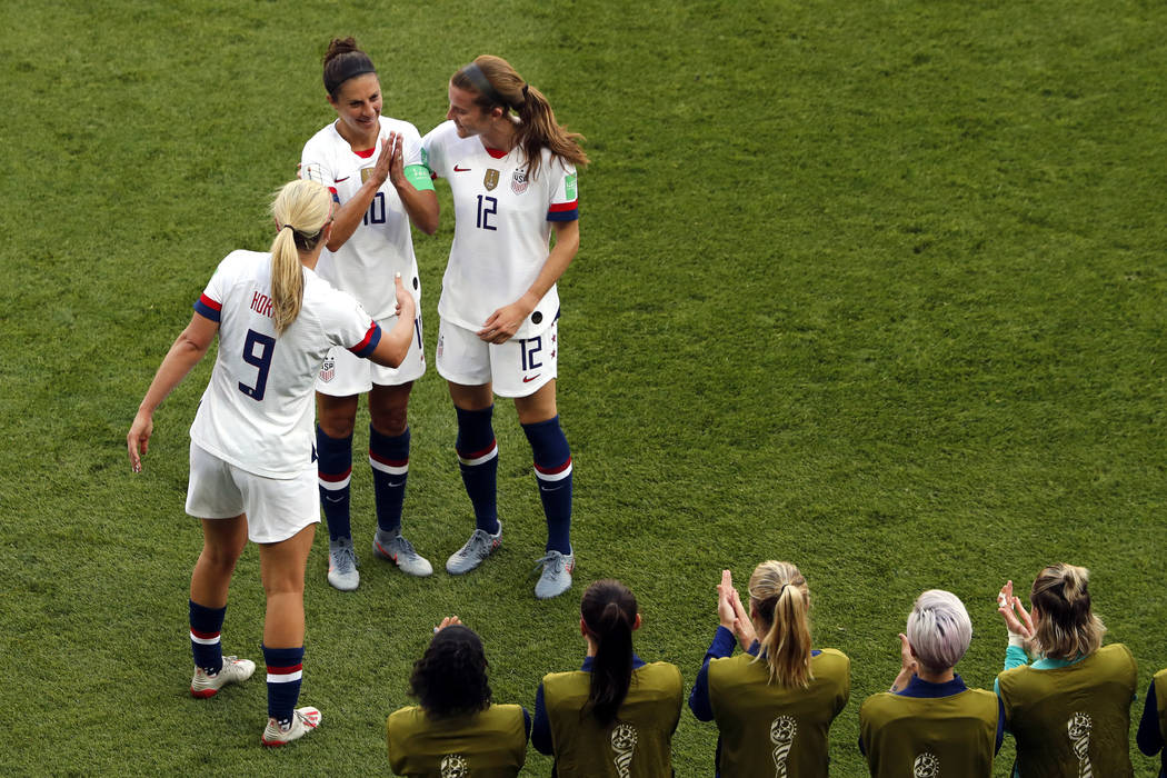 United States' Carli Lloyd, top center, celebrates with Lindsey Horan and Tierna Davidson, righ ...