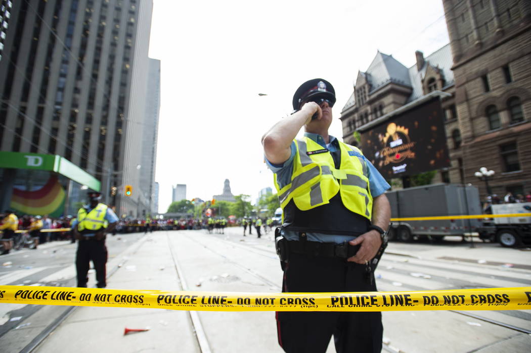 Toronto Police secure the scene after a shots were fired during the Toronto Raptors NBA basketb ...