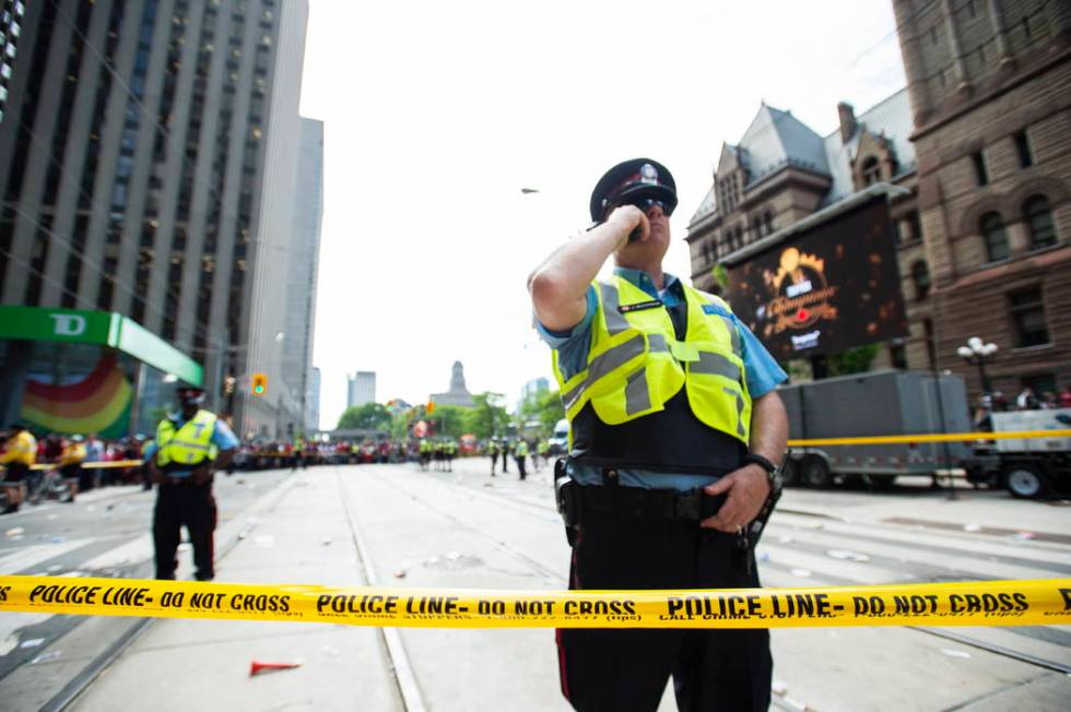 Toronto Police secure the scene after a shots were fired during the Toronto Raptors NBA basketb ...