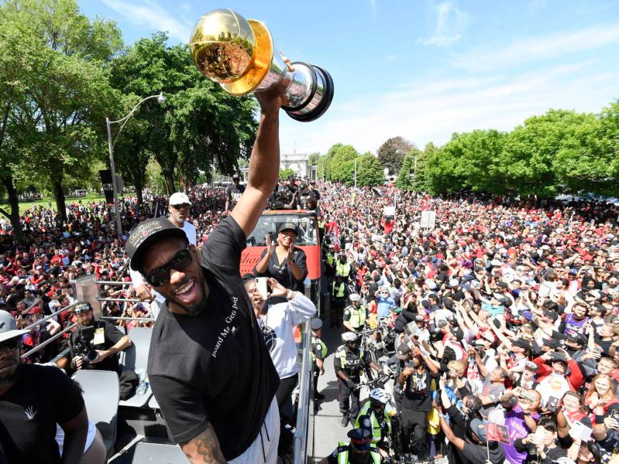 Toronto Raptors forward Kawhi Leonard holds his playoffs MVP trophy during the NBA basketball c ...