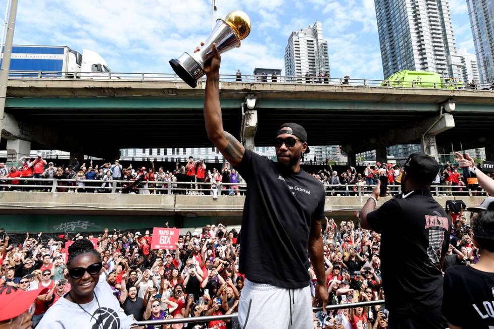 Toronto Raptors forward Kawhi Leonard holds his playoffs MVP trophy during the NBA basketball c ...