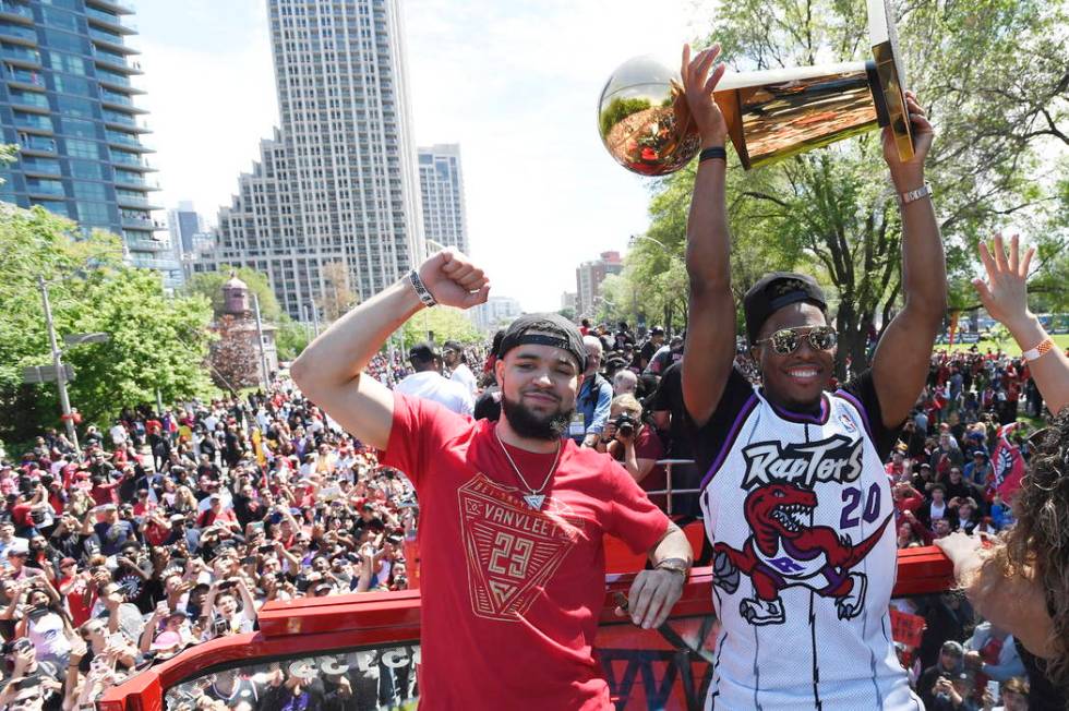 Toronto Raptors guard Fred VanVleet, left, and guard Kyle Lowry celebrate during the NBA basket ...