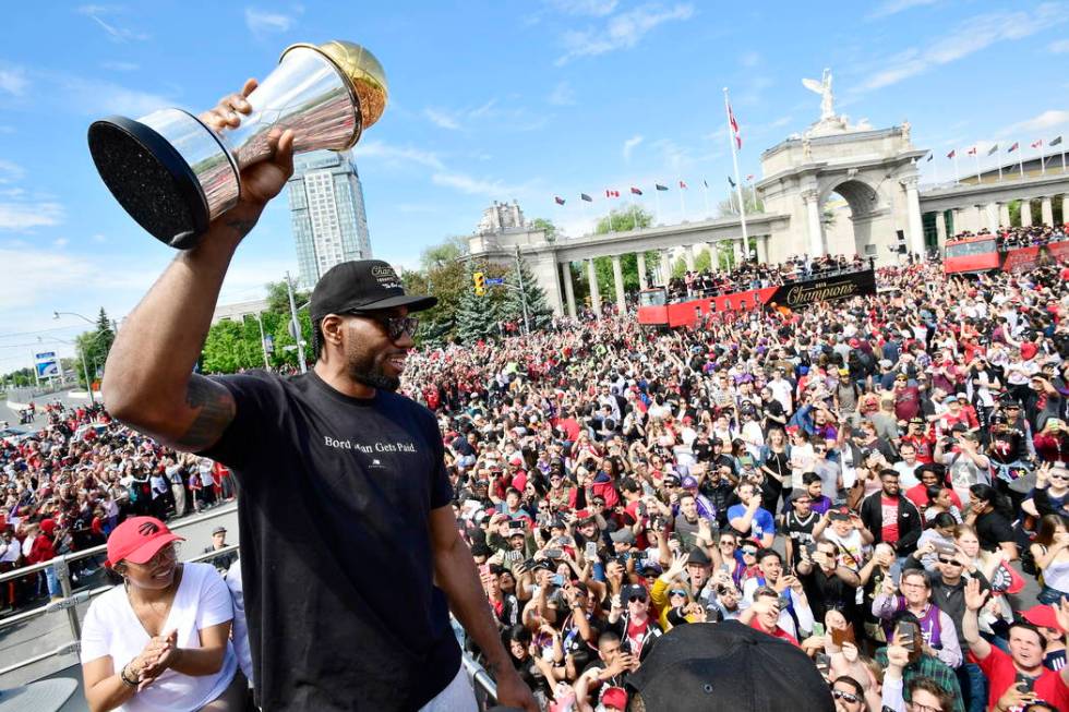 Toronto Raptors forward Kawhi Leonard holds his playoffs MVP trophy during the NBA basketball c ...