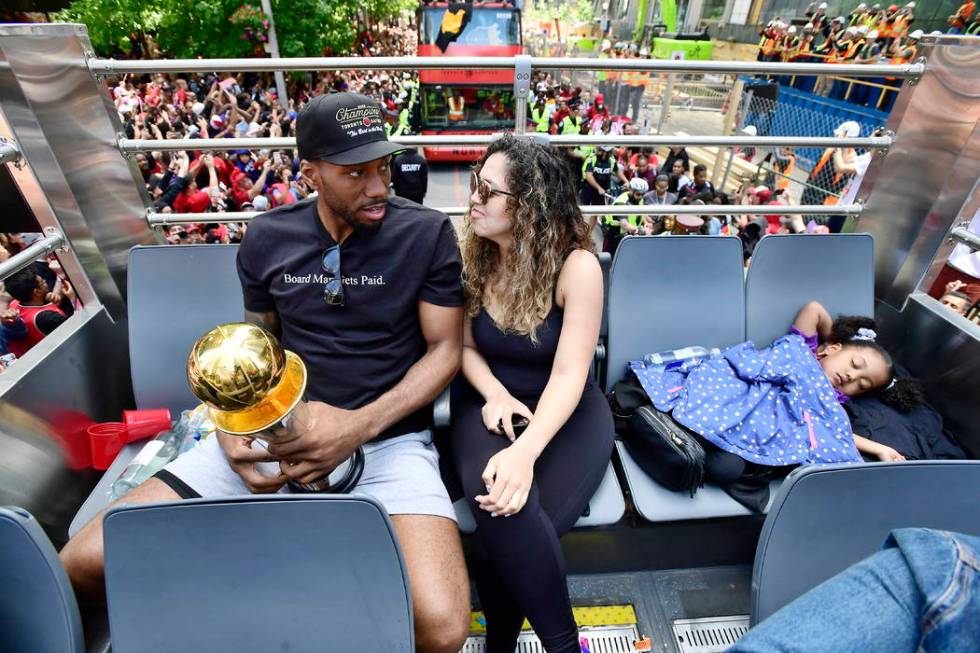 Toronto Raptors forward Kawhi Leonard and his girlfriend Kishele Shipley take a seat as their d ...