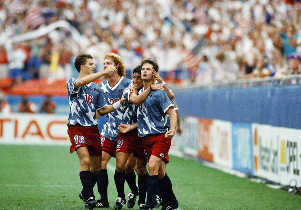 United States national team forward Eric Wynalda (11), right, is congratulated by teammates aft ...