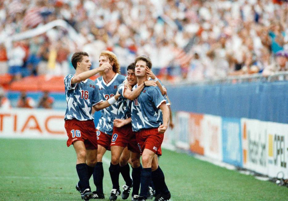 United States national team forward Eric Wynalda (11), right, is congratulated by teammates aft ...
