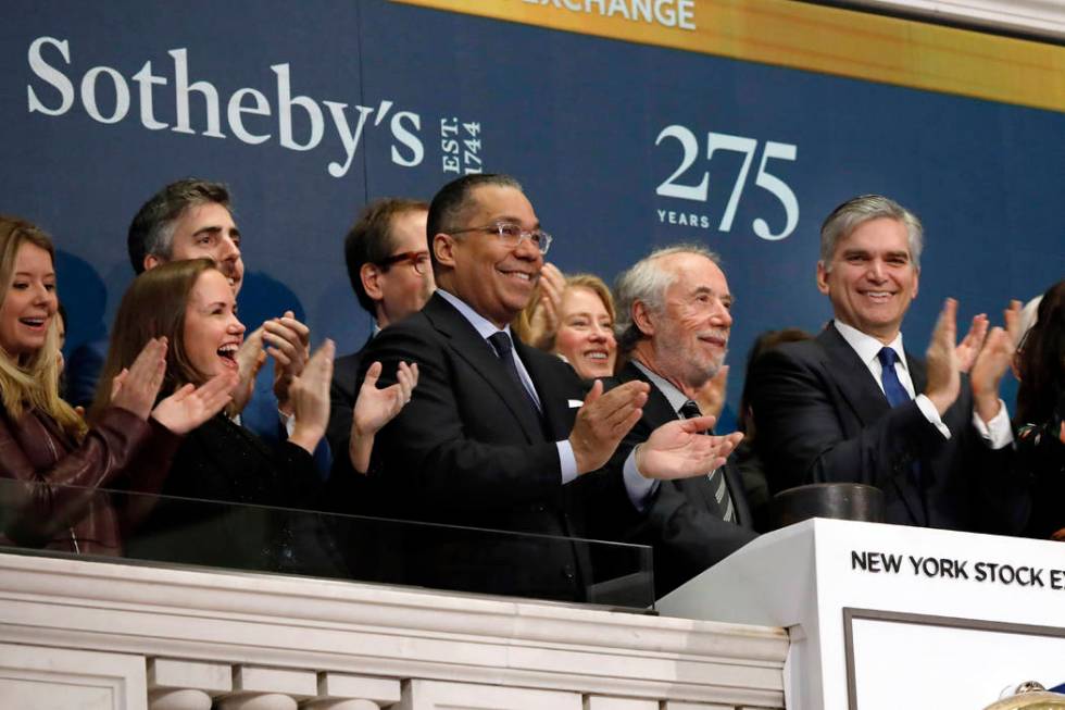 FILE - In this March 11, 2019, file photo Sotheby's Chairman Domenico De Sole, second from righ ...