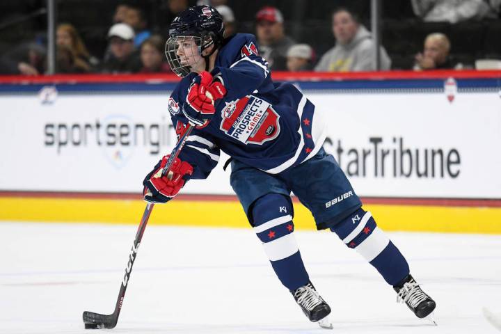 Team Leopold forward Cole Caufield (14) makes a pass during the USA Hockey All-American Prospec ...