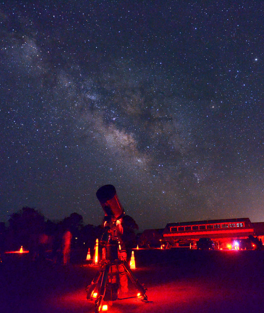 Red lights illuminate telescopes and stargazers during the annual Star Party at Grand Canyon Na ...