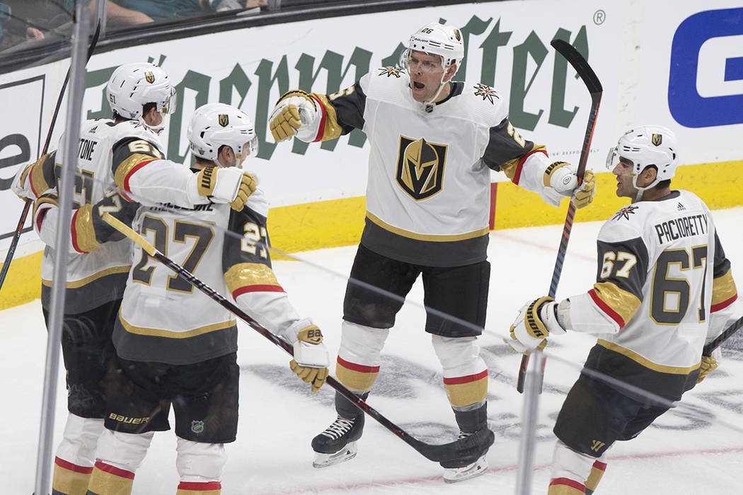 Golden Knights center Paul Stastny (26) celebrates with teammates Max Pacioretty (67) and Shea ...
