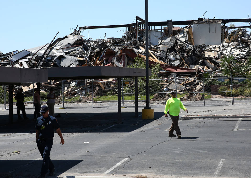 The rubble of burned-out office building at The Park at 3900 Paradise Road is seen on Tuesday, ...