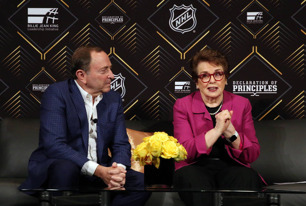 The National Hockey League commissioner Gary Bettman, left, listens as tennis icon Billie Jean ...