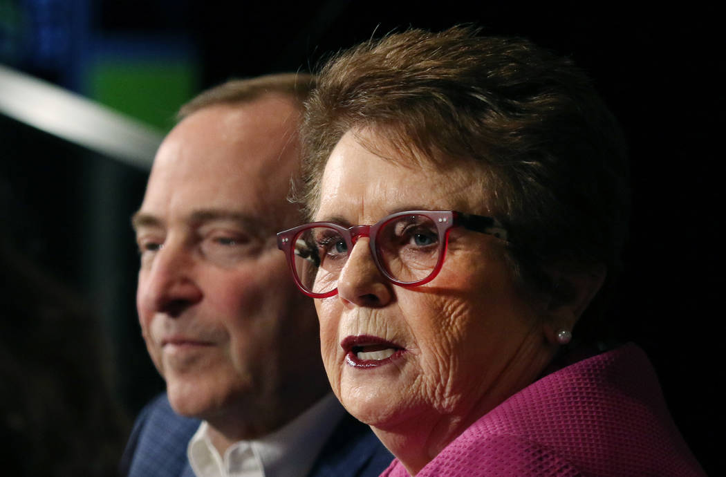 The National Hockey League commissioner Gary Bettman, left, listens as tennis icon Billie Jean ...