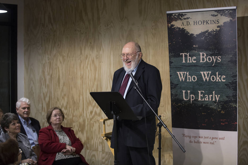 Author A.D. Hopkins reads from his novel "The Boys Who Woke Up Early" during a book r ...