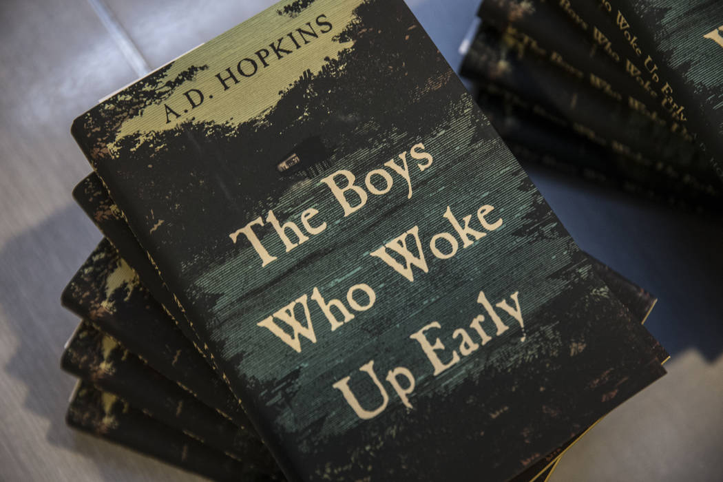 Copies of A.D. Hopkins novel "The Boys Who Woke Up Early" during a book release party ...