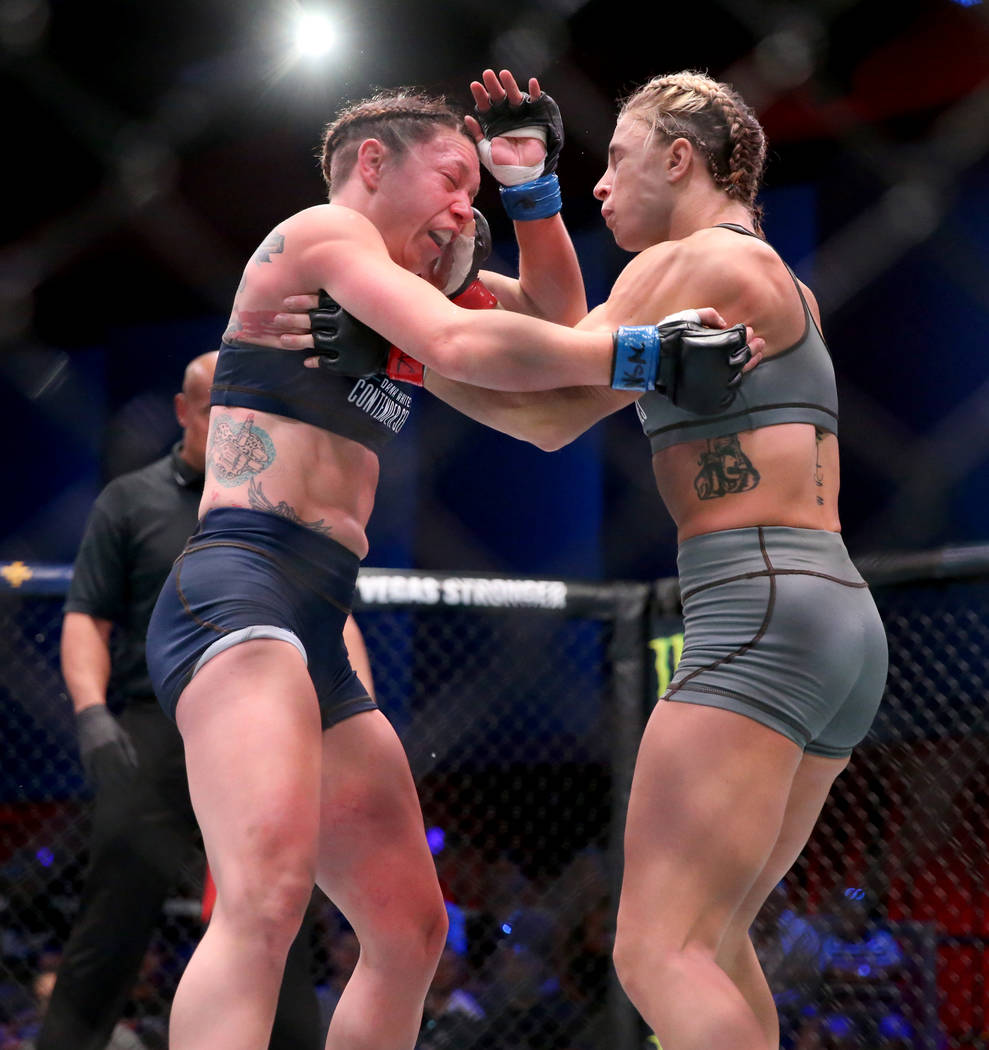 Hannah Goldy lands a punch to Kali Robbins in the second round of their strawweight bout on the ...