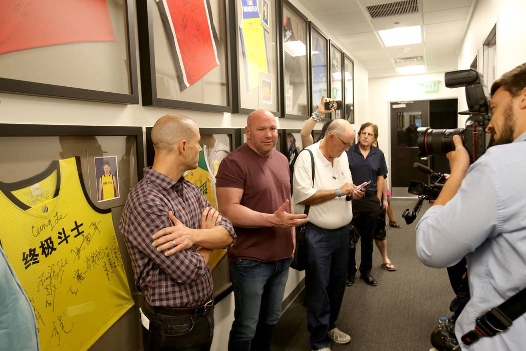 Ultimate Fighting Championship President Dana White, second from left, and Craig Borsari, UFC e ...