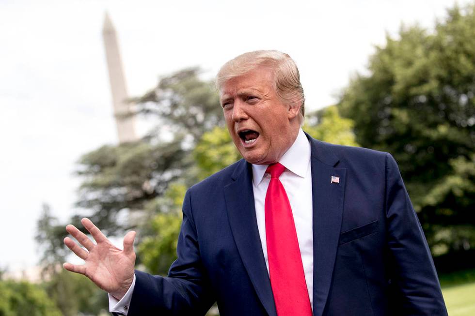 President Donald Trump speaks to reporters before boarding Marine One on the South Lawn of the ...