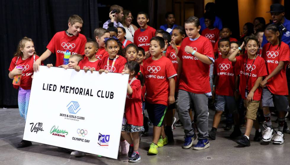 Lied Memorial Boys & Girls Club members march in the procession on Olympic Day at the Orlea ...